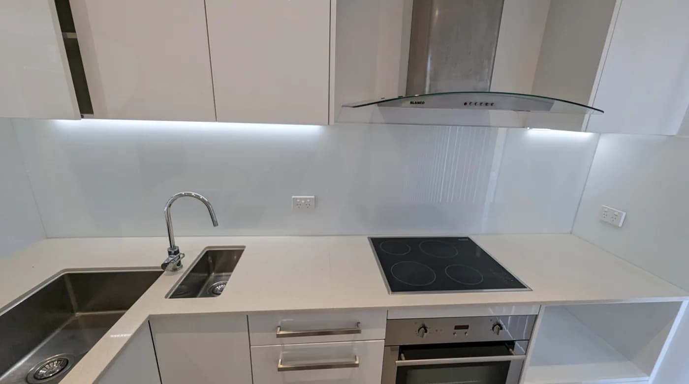 LED strip lighting under the overhead cabinets of a kitchen