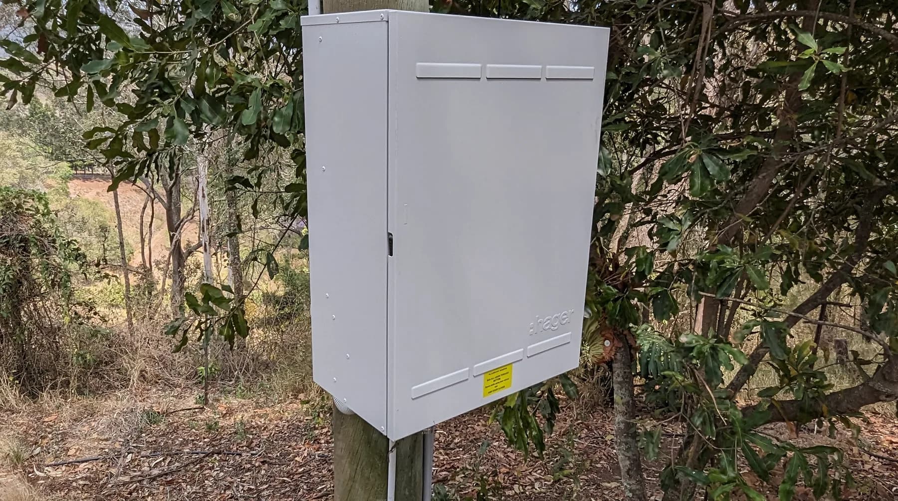 A meter enclosure mounted on a supply pole