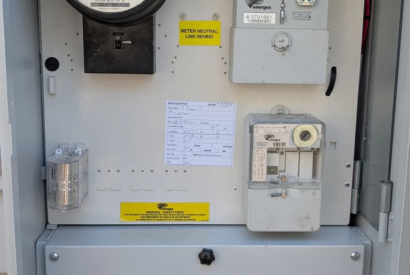 An open meter box showing the meter and main switch
