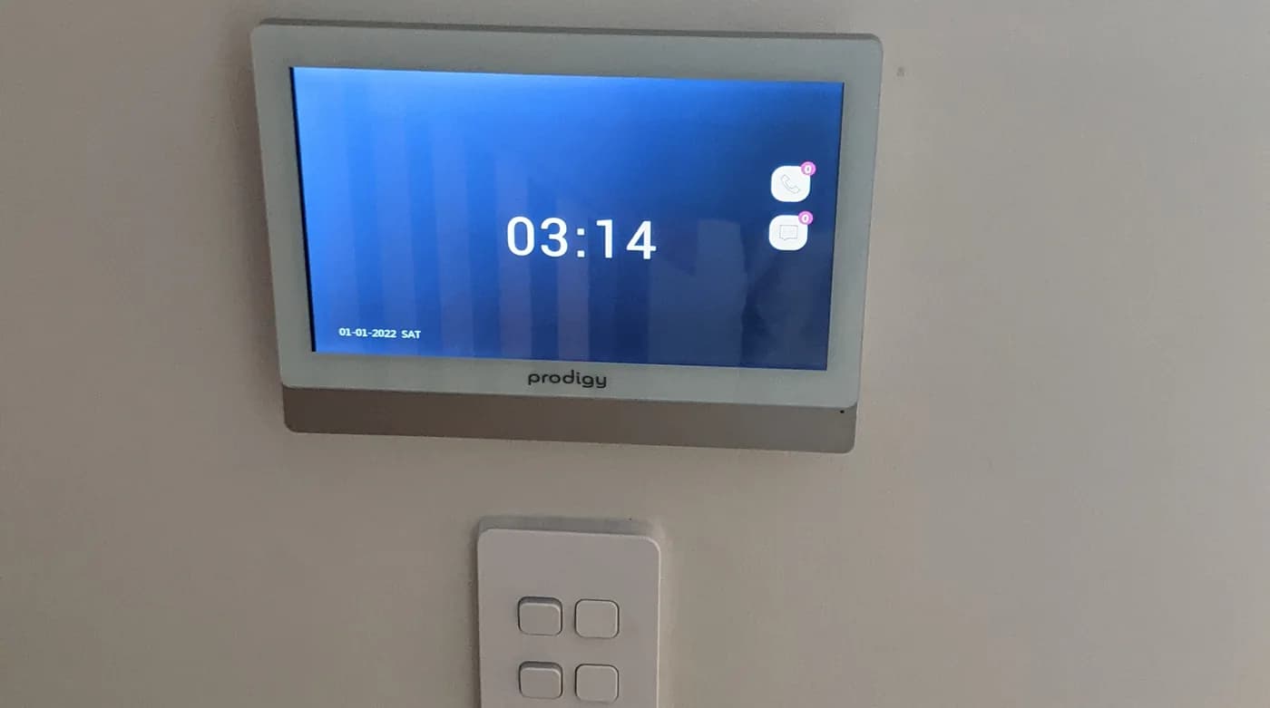 A smart home control panel mounted on a wall