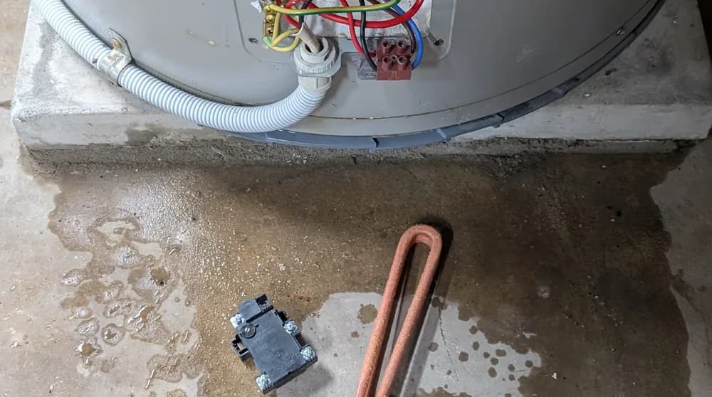 An electric hot water cylinder with the element access plate open