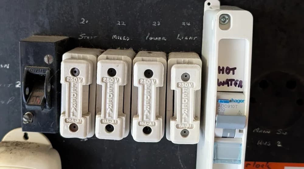 An old switchboard fitted with ceramic rewireable fuses