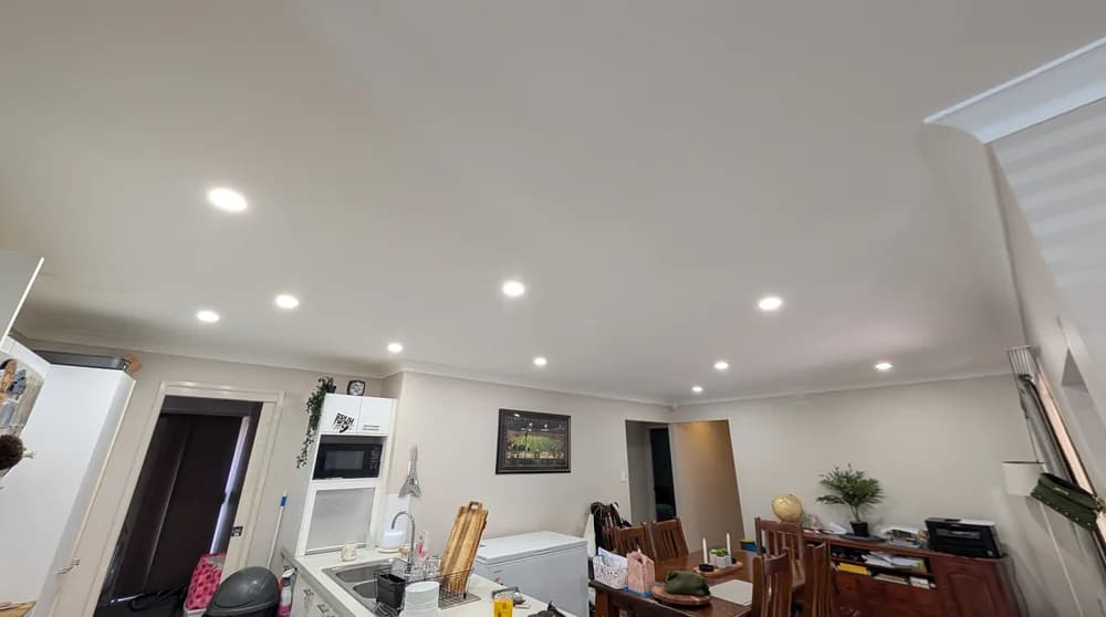 A living room with an even run of LED downlights
