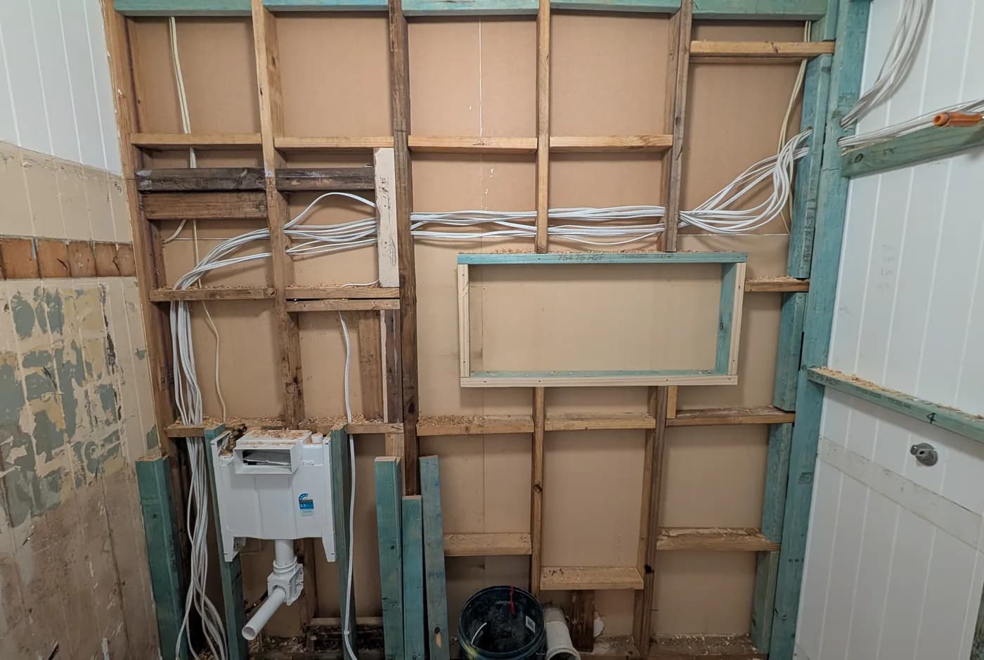 New cabling run through open wall framing during a rewire