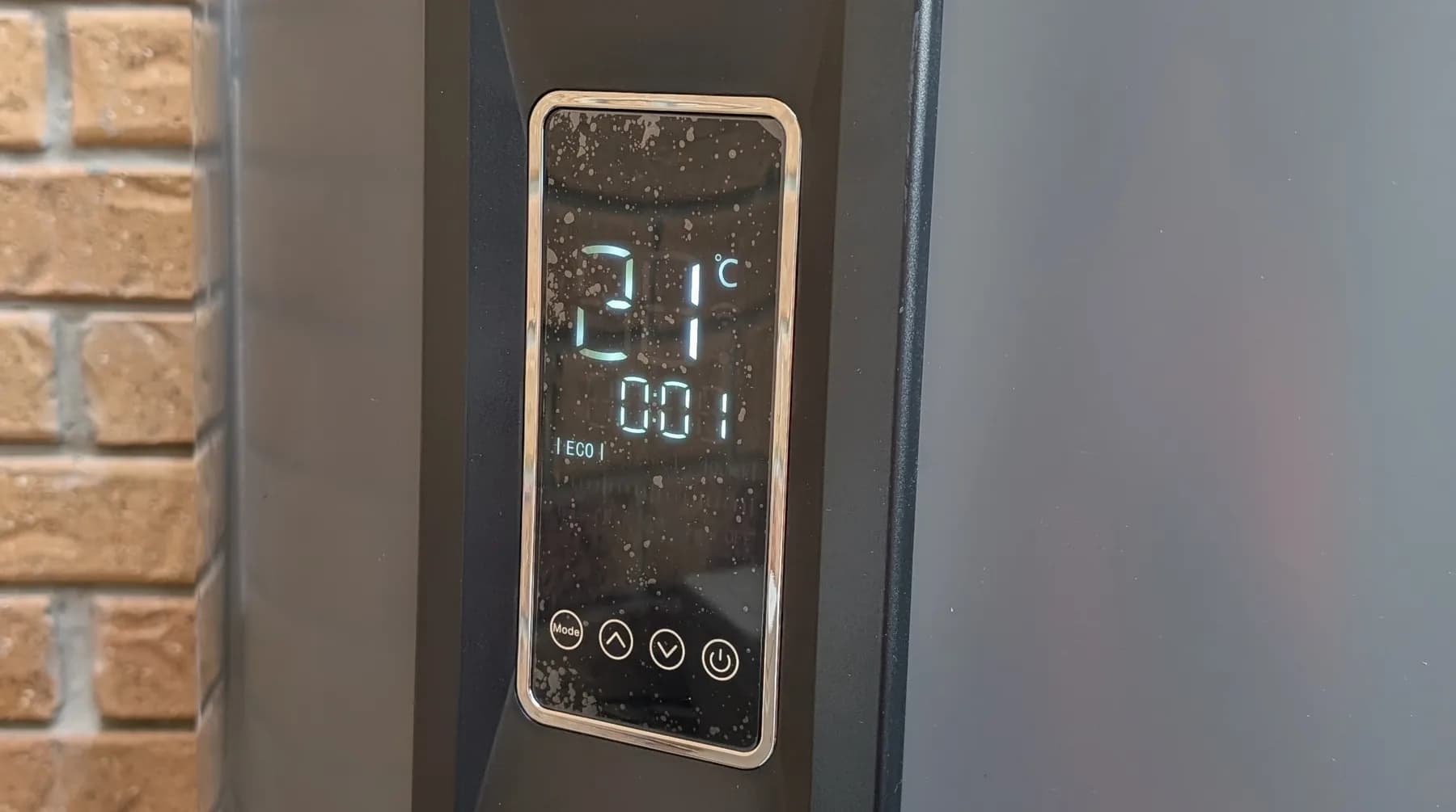 The digital control panel on an electric hot water system