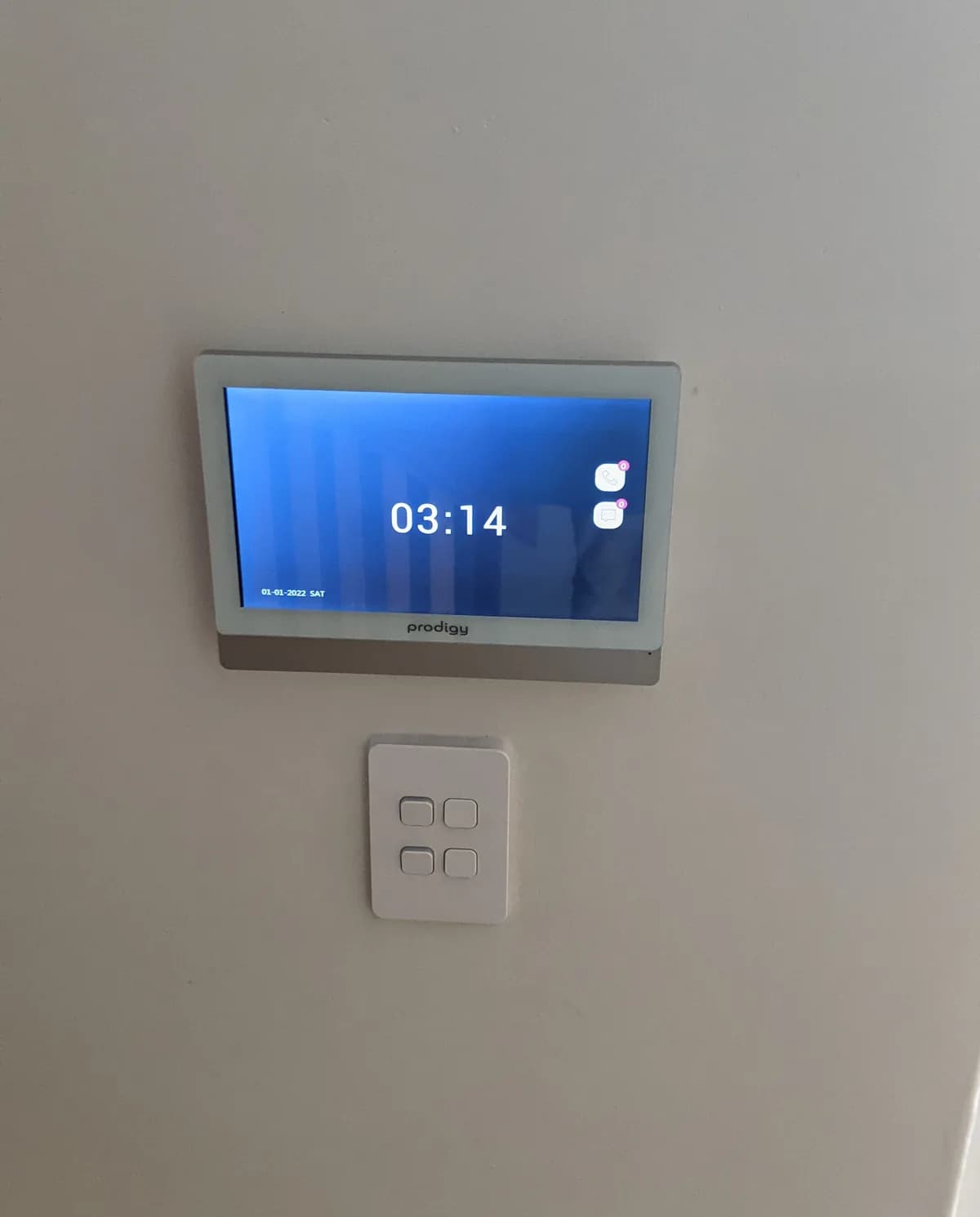 A smart home control panel mounted on a wall