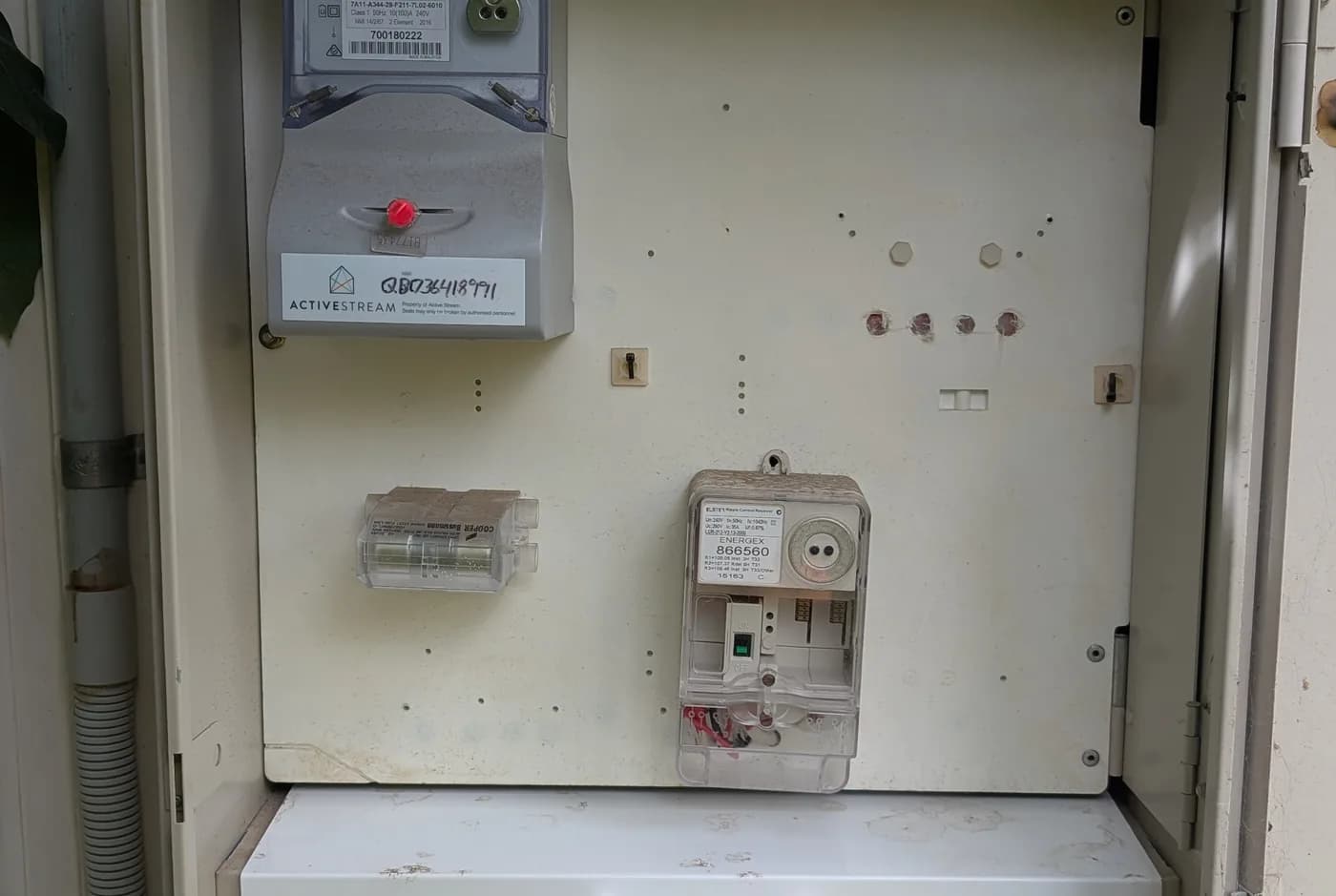 An open meter box with the circuit protection visible