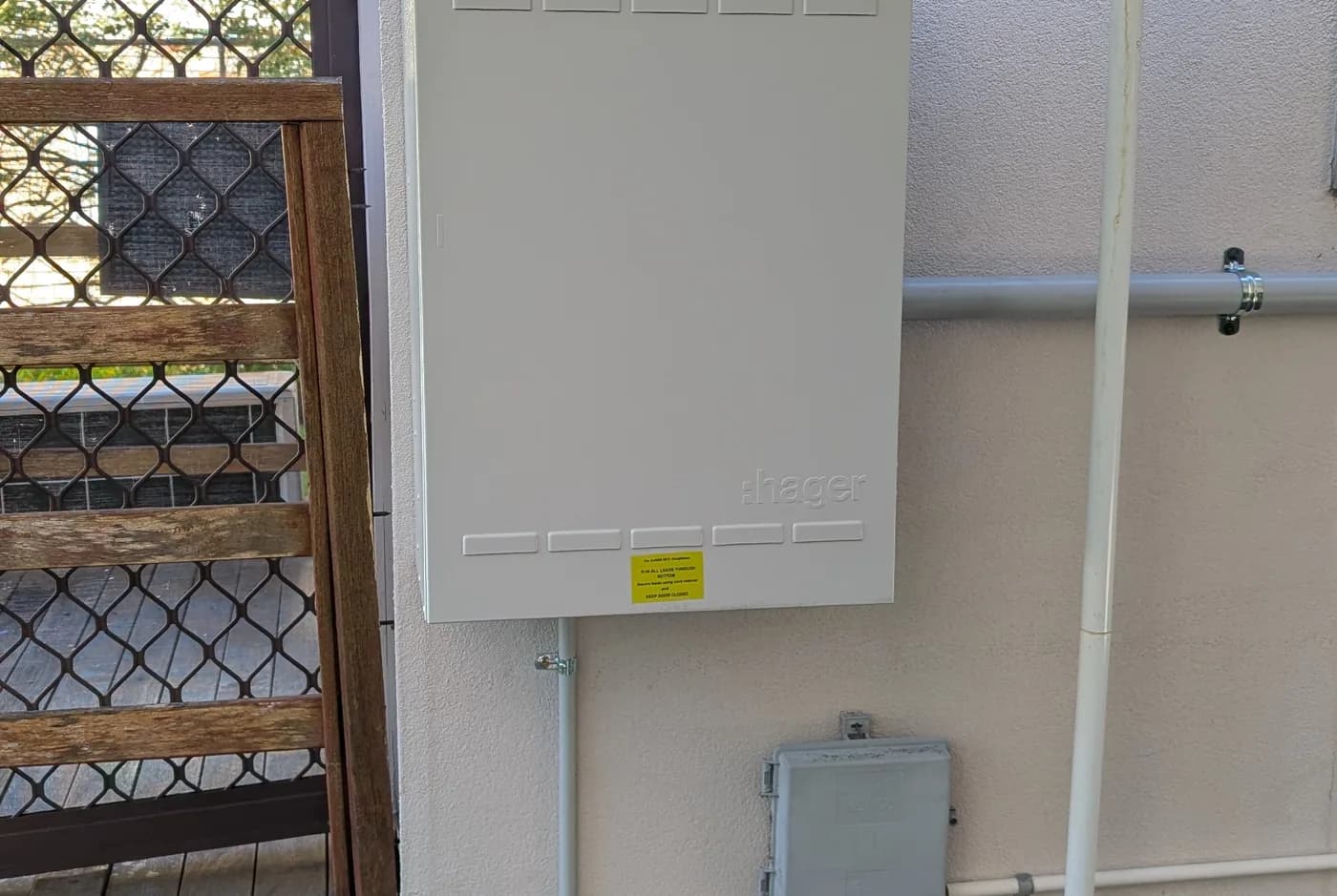 A switchboard enclosure mounted on an exterior wall