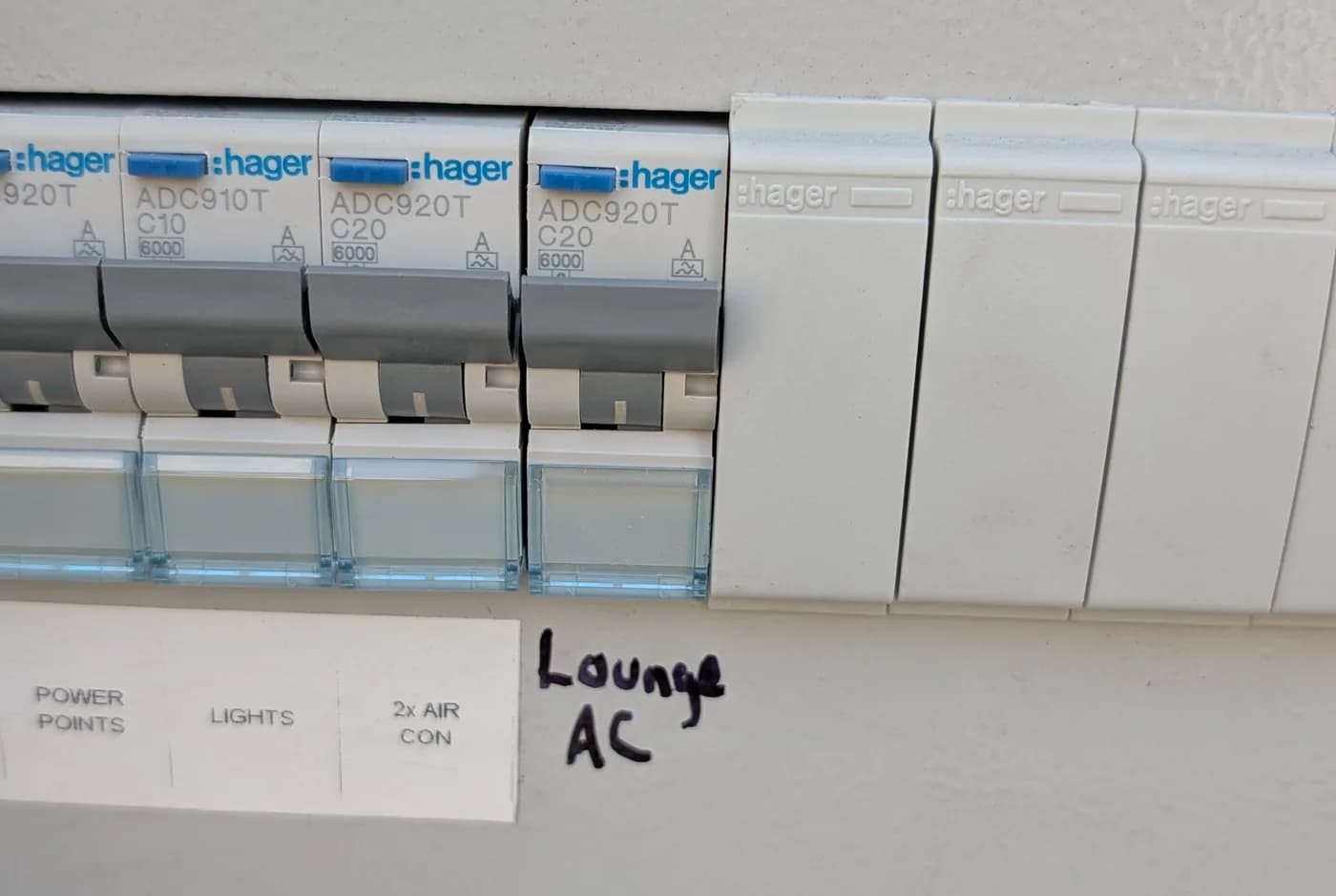 A meter panel with the utility seal and a row of circuit breakers